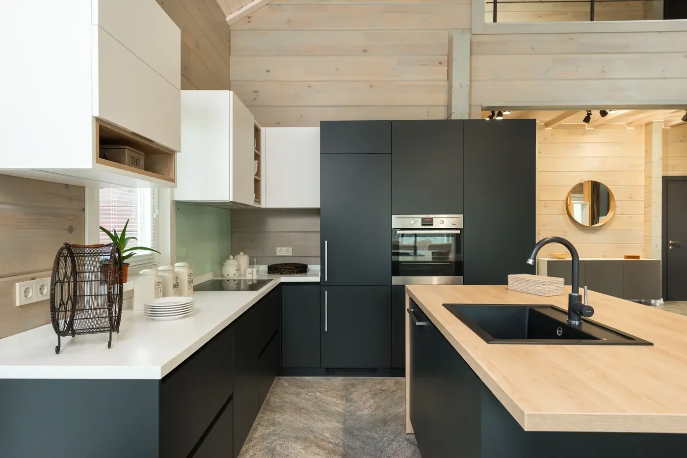 Representative modern custom-home kitchen with integrated appliances, cabinetry, island, and clear circulation