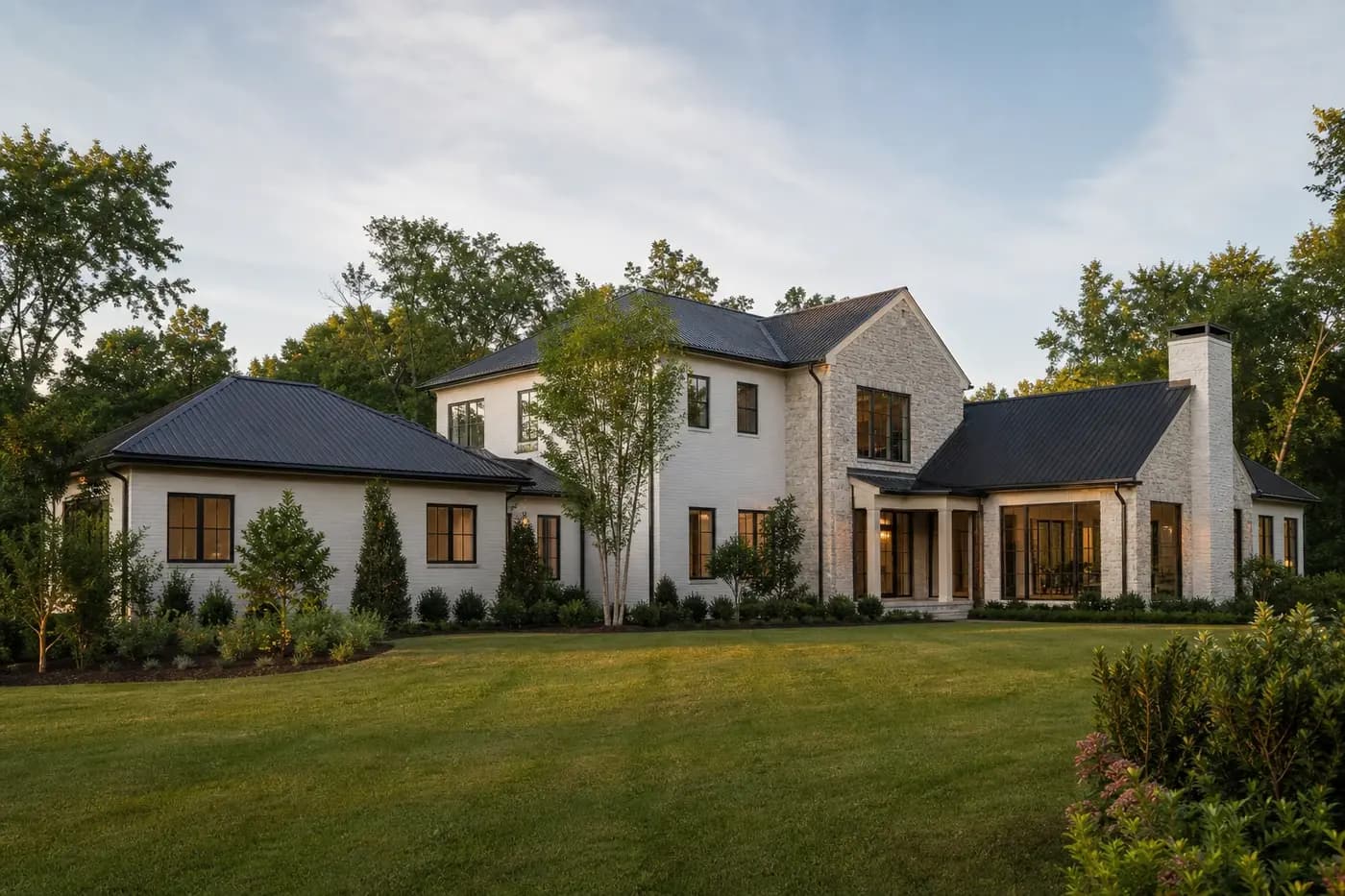 Luxury Charlotte custom home combining a main-level living wing with a restrained two-story central volume