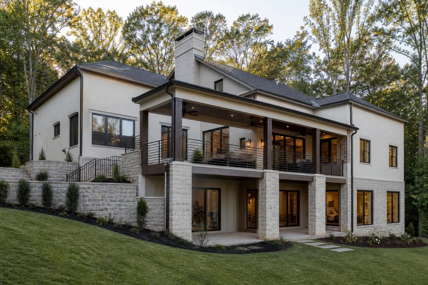 New Charlotte luxury custom home with a daylight walkout basement integrated into a wooded rear slope