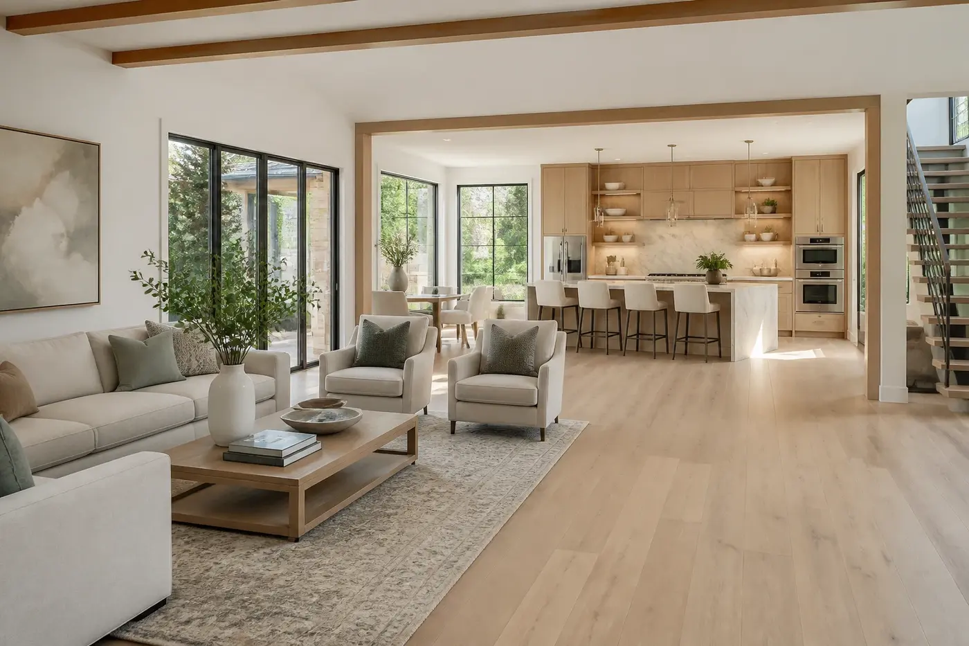 New Charlotte custom-home great room connected to a white oak kitchen with a clear circulation path between the spaces