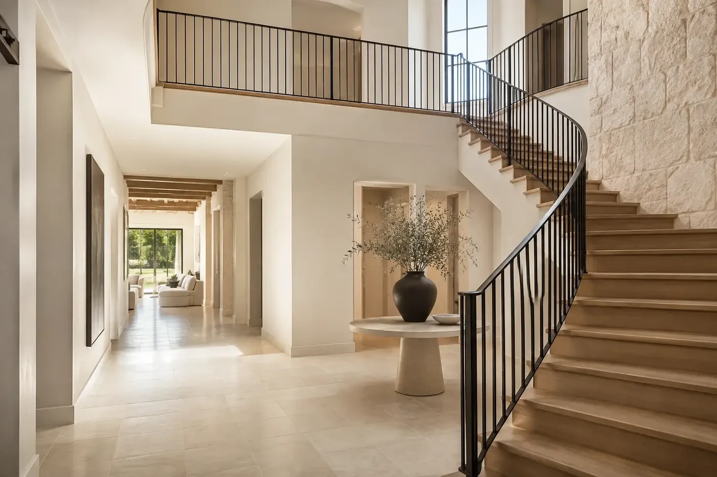 New Charlotte custom-home stair hall with coordinated landings, guardrails, double-height opening, windows, and ceiling transitions