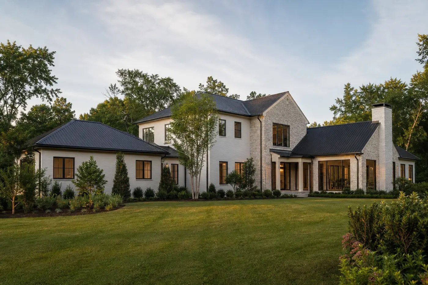 Luxury Charlotte custom home combining a main-level living wing with a restrained two-story central volume